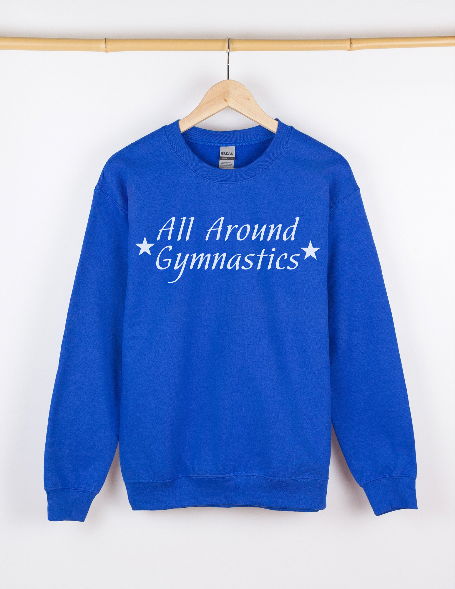 Blue sweatshirt with 'All Around Gymnastics' text on a hanger against a white background